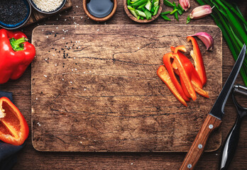 Asian cuisine ingredients, food background. Ginger, chili pepper, garlic, paprika, soy sauce and rice vinegar on rustic wooden kitchen table. Healthy eating concept. Top view - obrazy, fototapety, plakaty