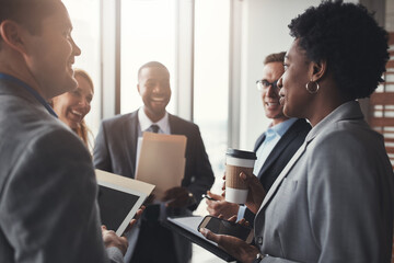 Success is more easily achieved as a team. High angle shot of a group of corporate businesspeople...