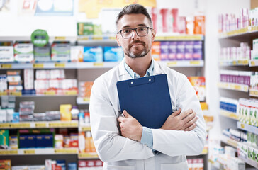 Dealing with your health concerns with confidence. Portrait of a confident mature pharmacist working in a pharmacy.