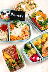 Restaurant healthy food delivery in take away boxes for daily nutrition on white background.