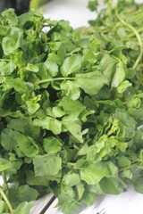 a bunch of watercress on the table