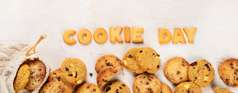 National Cookie Day with yummy freshly chocolate chip cookies on a white background. Top view.
