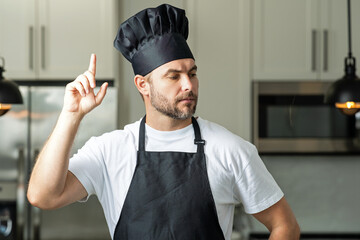 Idea for food. Portrait of chef, cooks or baker. Man in cook hat and chef uniform cooking on...