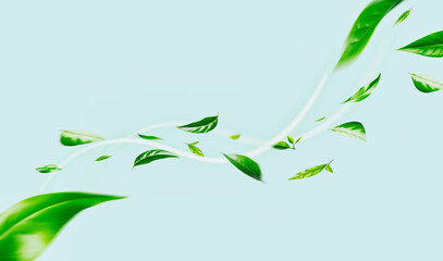 Flying green leaves on blue background. Fresh spring foliage. Environment and ecology backdrop