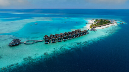 The Tropical aerial view with maldives paradise scenery seascape with water villas as amazing sea and lagoon beach, Exotic tourism