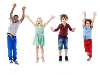 Happy, jumping and portrait of children in studio for diversity, friends and playing. Happiness,...
