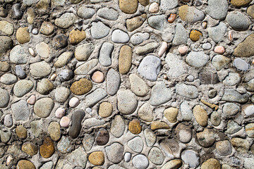 Wall background, round pebbles, like a wall.