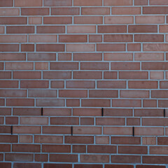 Texture of red brick wall closeup