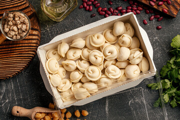 Semi finished russian dumplings pelmeni packed in a box