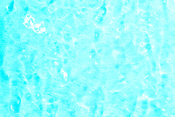 Cosmetic gel close-up with oxygen bubbles. Textured background with microbrushes in cosmetics. Moisturizing skin serum with vitamins and collagen.