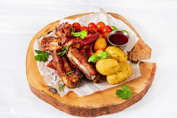 grilled ribs with potatoes and vegetables