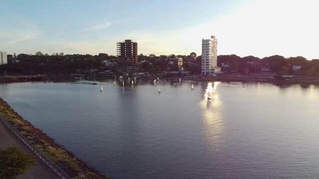 Mesmerizing push-in aerial shot of Leon Sero yacht club at sunset