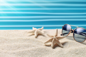 Fototapeta na wymiar Tropical beach with sunbathing accessories, summer holiday background 
