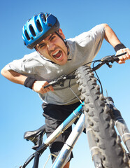 Portrait, angry cyclist and crazy face with bicycle closeup on blue sky background or cycle...