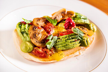 gourmet pancake with vegetables and sauce