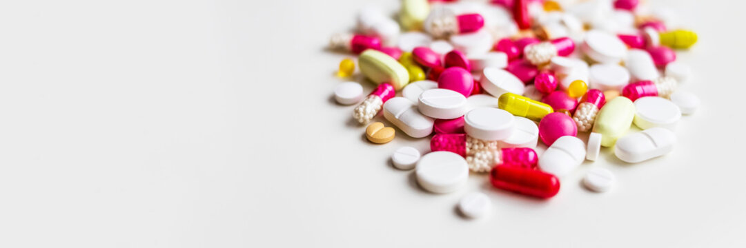 Frame of colorful antibiotic capsule pills. Antibiotic drug resistance concept. Pharmaceutical industry. Healthcare and medicine. Medical care.a lot of pills medicine isolated on white background