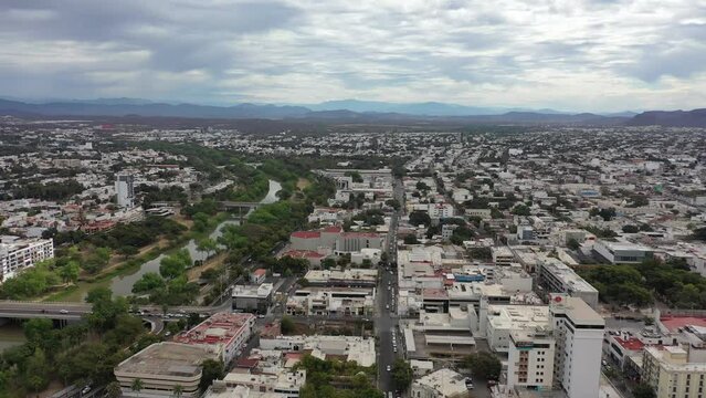 Culiacan sinaloa city, wide view from sky, tres rios river and downtown city from the sky drone view 4k, Mexico republic, ciudad de culiacan sinaloa desde el cielo con toma de dron 4k.