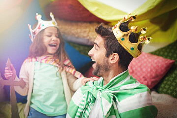Fantasy, child dress up and dad with princess fun in a bedroom fort with costume, girl and papa together. Play castle, happiness and smile with father and child in home laughing and happy about game © Hova/peopleimages.com