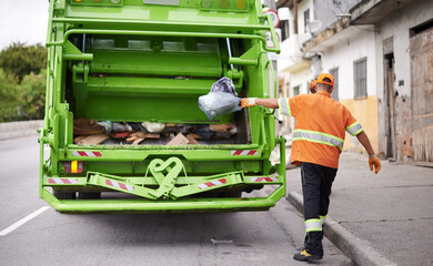 Waste, truck and man with garbage, collection and recycling in the community, city and clean. Back,...