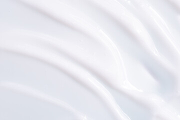 Skin cream texture. Background with smeared white cream. Moisturizing lotion for face and body.