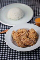 Fried Chicken served with rice, chilli sauce and cheese sauce.