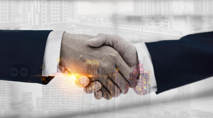 Double exposure of business handshake for successful of investment deal and city night background, teamwork and partnership concept.