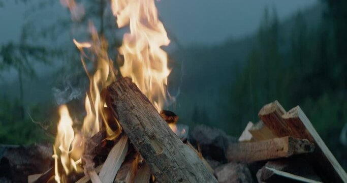 Perfect campfire burning at a mountainside campsite