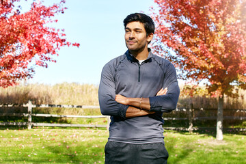 I keep my mind and body strong. a sporty young man standing outdoors.