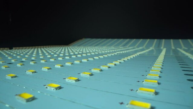 LED technology chip in manufacture. Close up shot. Dark background. Energy concept.