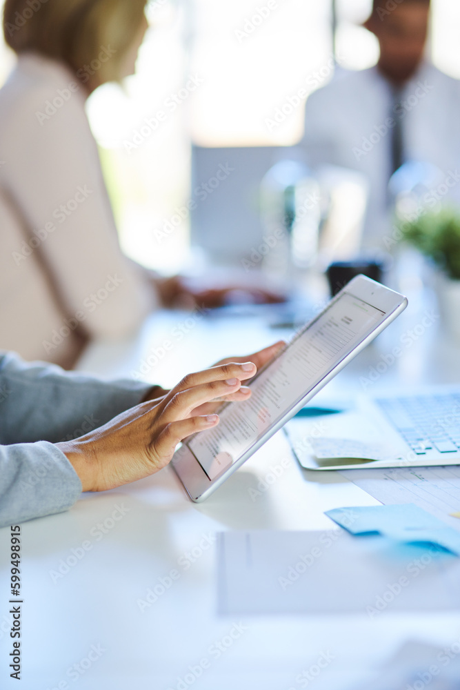 Wall mural taking notes in the meeting. an unrecognizable businesswoman using a tablet in the workplace.