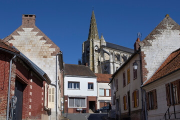 View of the church of St. John the Baptist and the main road through the village of Long in the Somme department of Northern France.