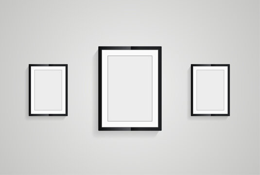 Three picture frames with black blank hanging on the whitewall for mock up design, vector black photo frames in diferent sizes of wooden Frames Hanging on the wall