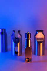 High quality steel detail production of CNC machining. Shafts and gears, neon color