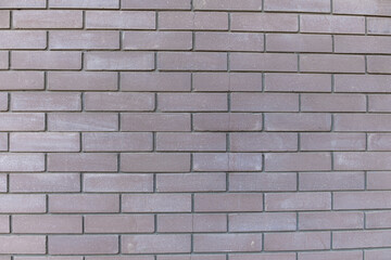 Dark gray brick wall as texture, background, pattern