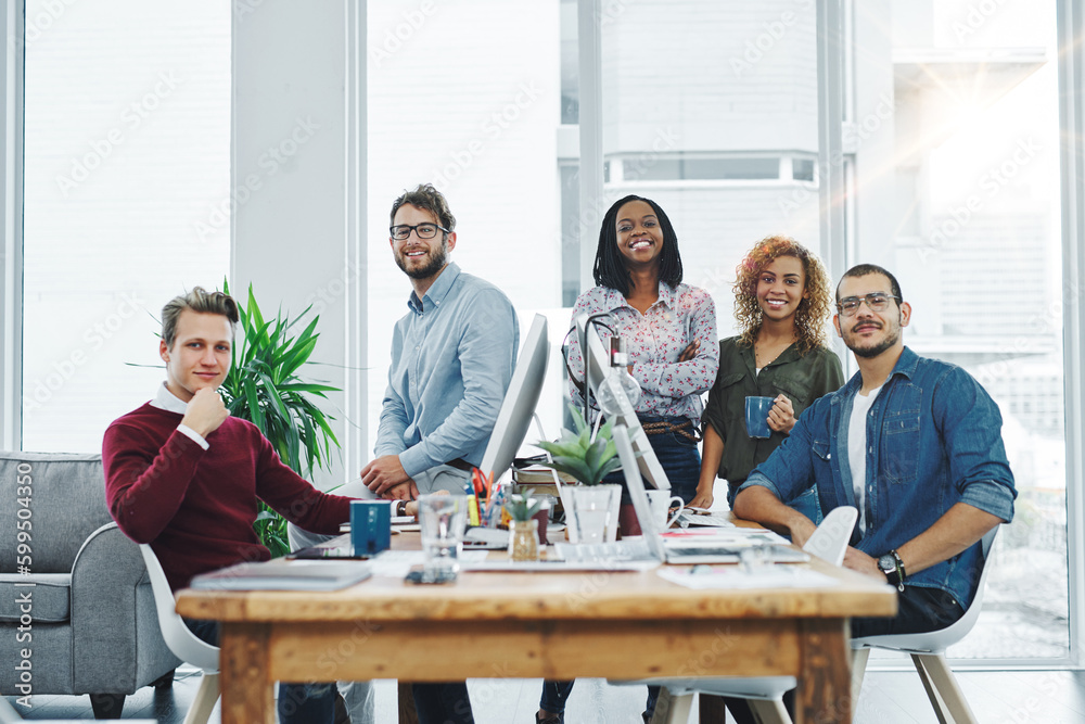 Poster you wont find a more hardworking team. portrait of a team of young go getters working in a modern of