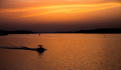 Beautiful Sunset on Danube River, quiet and calm Zemunski Kej, silhouette 