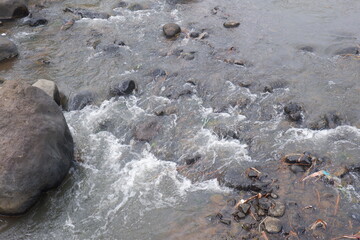 Obraz premium Mountain river with clear water. The rapid flow of a mountain river
