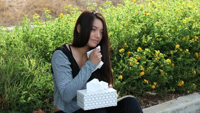 Allergy Woman Gray Top Sneezes and Grabs Tissue