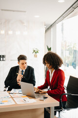 Portrait of success business people working together in office. Couple teamwork startup concept..