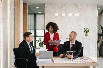  Young business creative team are brainstorming planning discussing while sitting in creative business discussing work in the office