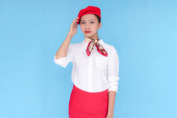 A flight attendant or stewardess stressed and having a headache. A hostess with her hand on her...