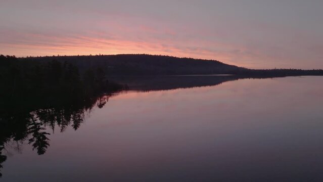 Spectacular golden hour sunrise over Monson Pond 