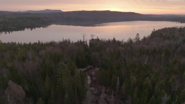 Colorful sunrise over Moosehead Pond 