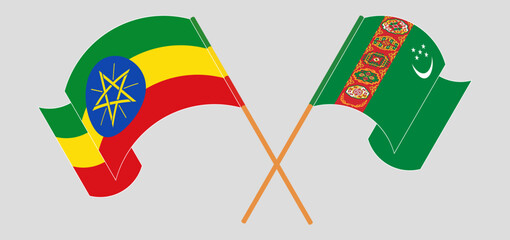 Crossed and waving flags of Ethiopia and Turkmenistan