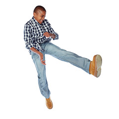 Naklejka premium Inspired to move. Studio shot of a young boy jumping energetically against a white background.