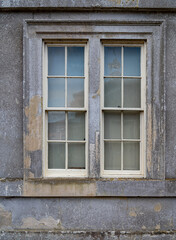 Fototapeta na wymiar Vintage Sash window with stone Mullions