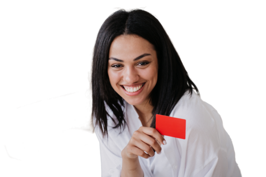 Cheerful Young African american entrepreneur with straight hair and toothy smile holding credit card, satisfied by her growing business. Happy successful girl against transparent background.