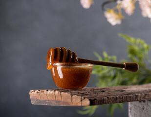 honey dripping from a jar