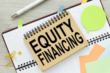 EQUITY FINANCING open diary. top view of text. Business and finance concept.