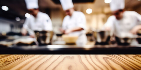 Fototapeta na wymiar Empty Wood table top with Chef cooking in restaurant kitchen blurred defocused background